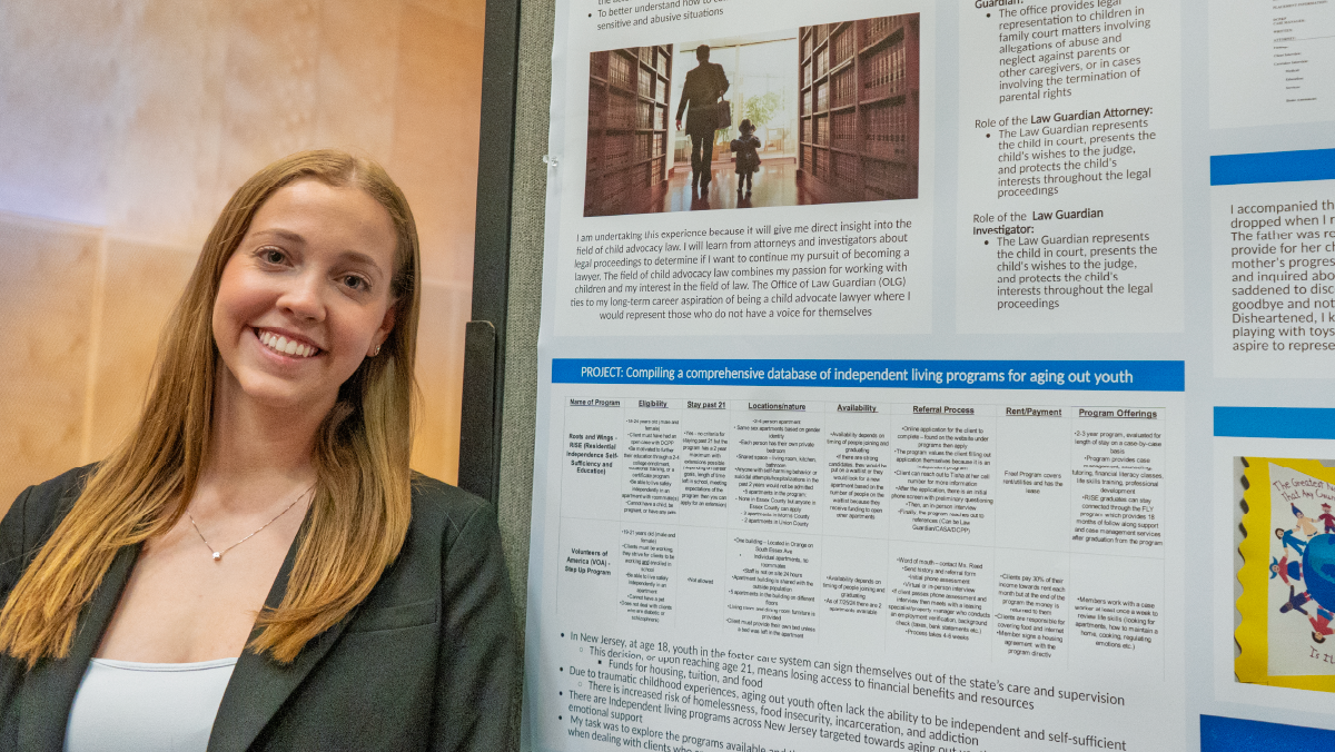 Student presenting research poster