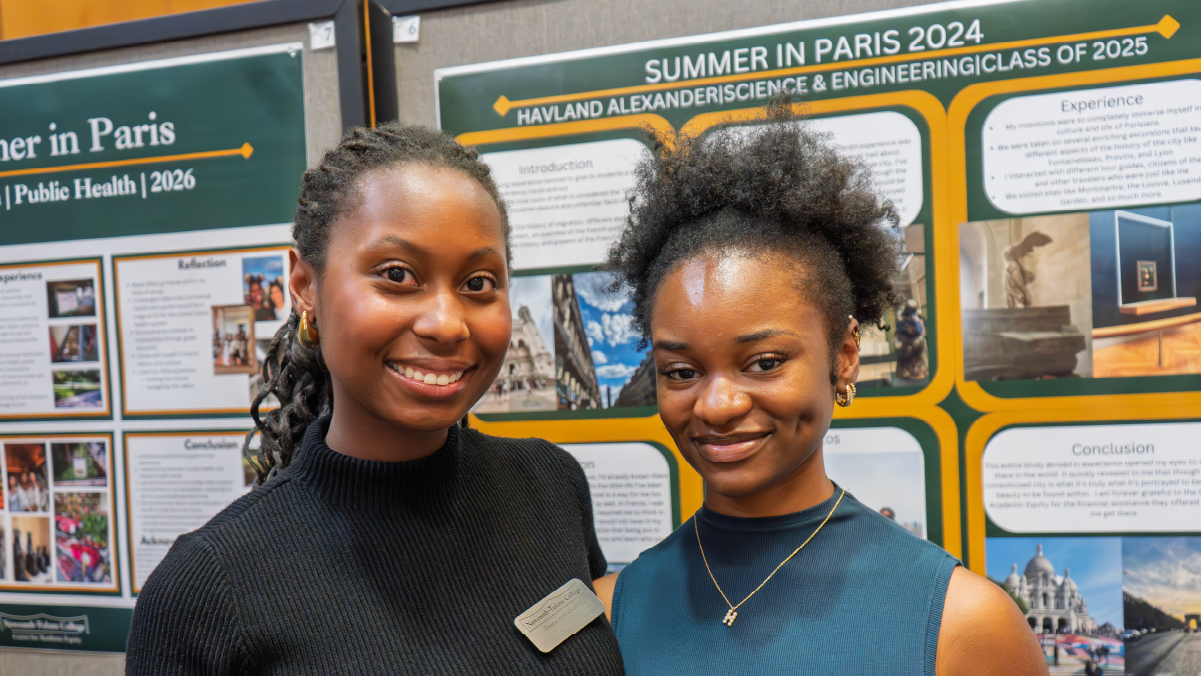 Student presenting research poster