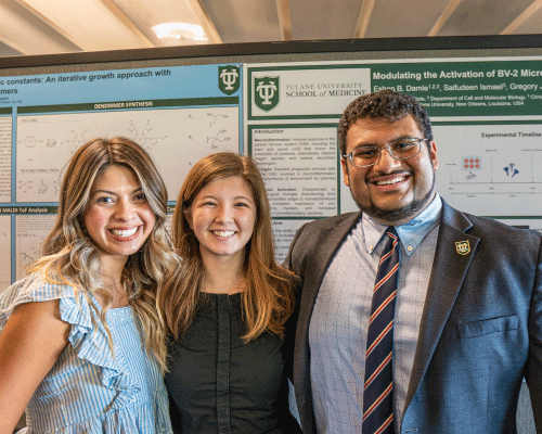 Student presenting research poster