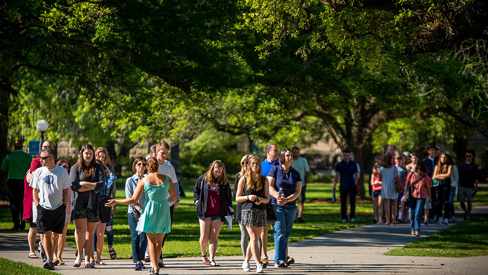 Students walking across academic quad